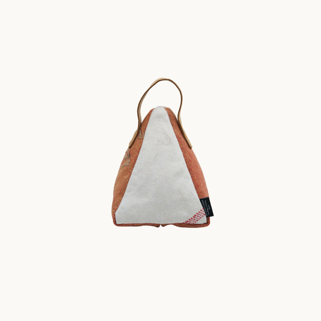 Cream and terracotta Moroccan silk Salabim door stop from the reverse, showing the plain cream panel and woven label #color_Cream and Terracotta