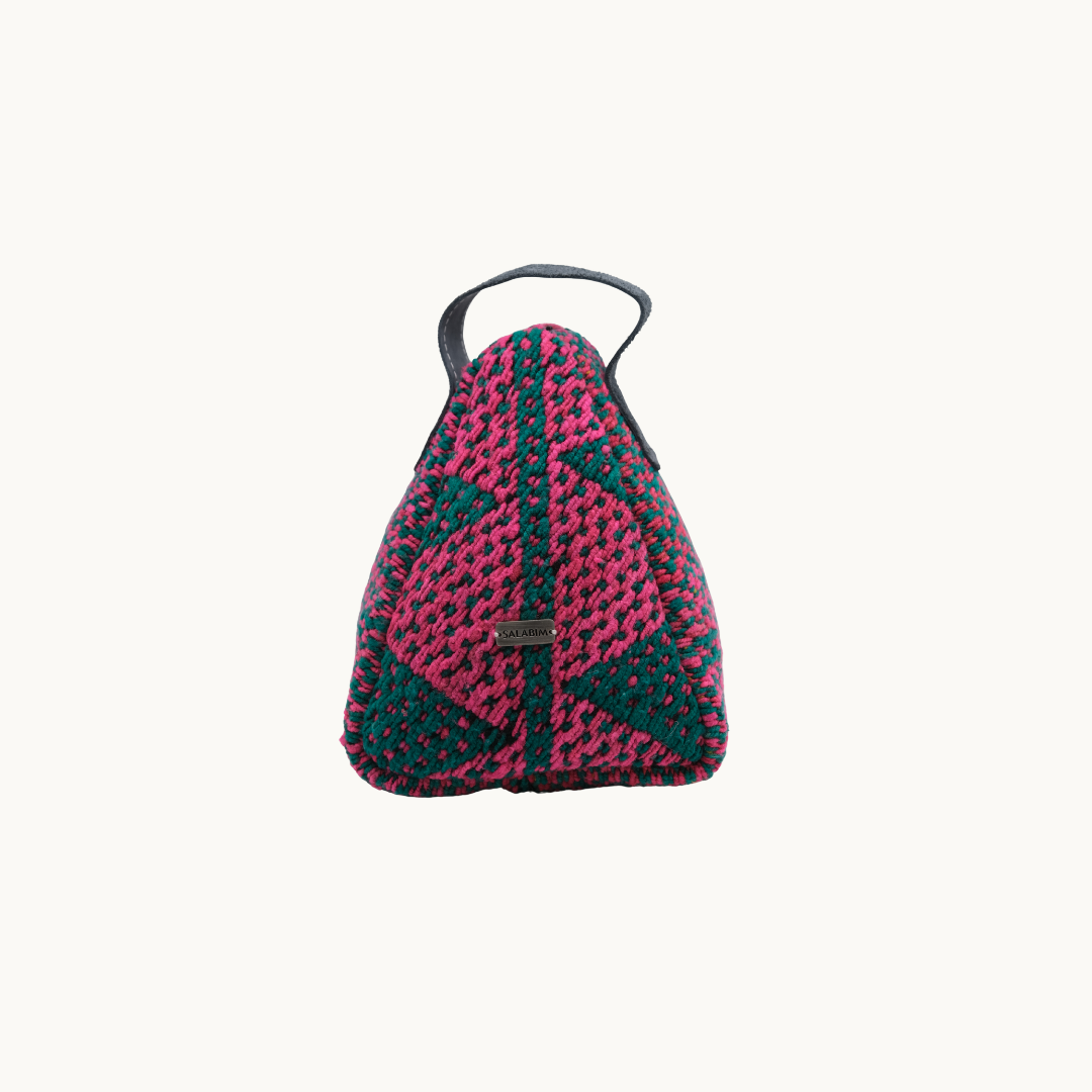 Salabim weighted door stop in magenta with dark teal triangles and a black leather loop, front view #color_Magenta and Teal