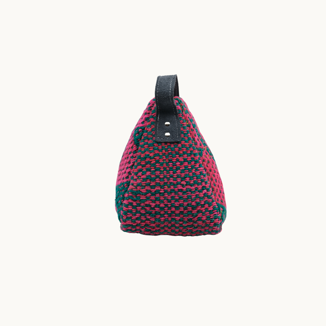 Side profile of the magenta and teal Salabim door stop, showing the riveted black leather carry loop #color_Magenta and Teal