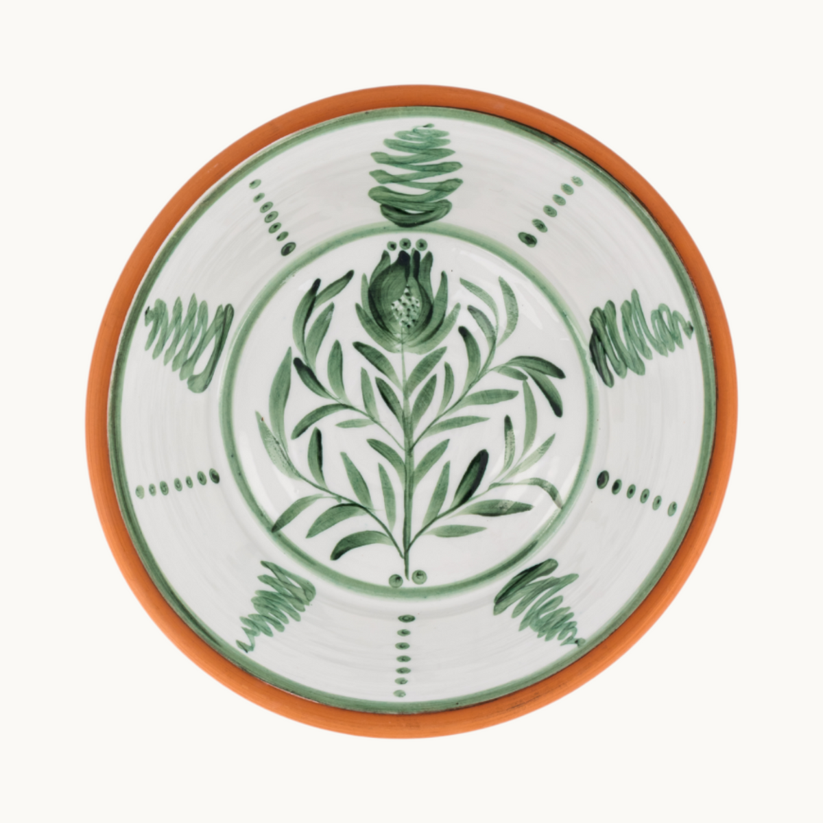 MANTRA LIVING Lebrillo platter in terracotta with a white glazed interior and hand-painted green botanical motifs.