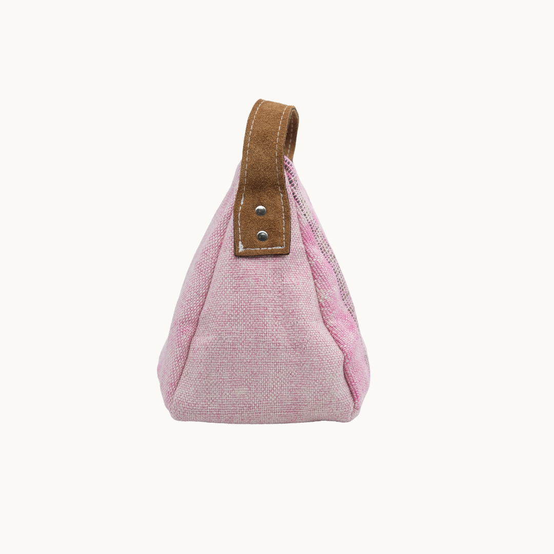 Blush pink Moroccan silk Salabim door stop in side profile, showing the riveted tan leather carry loop #color_Blush