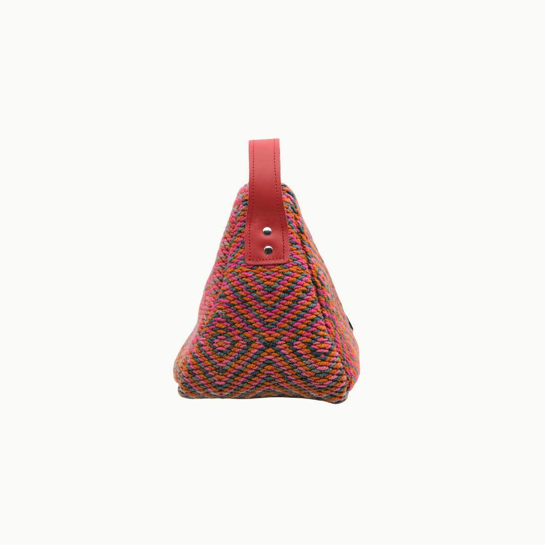 Side profile of the coral diamond Salabim door stop, showing the riveted coral leather carry loop #color_Coral Diamond