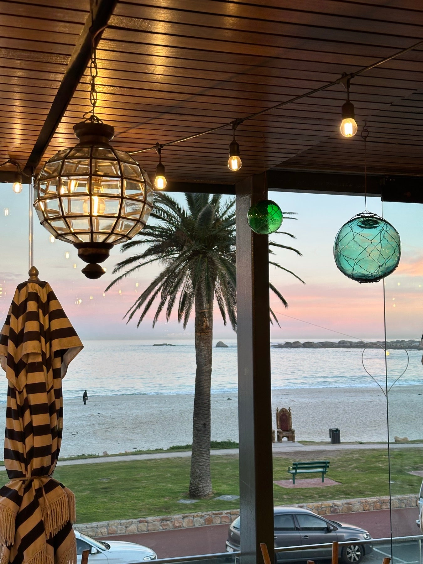 Looking out over the palms and the sea from the Camps Bay shop