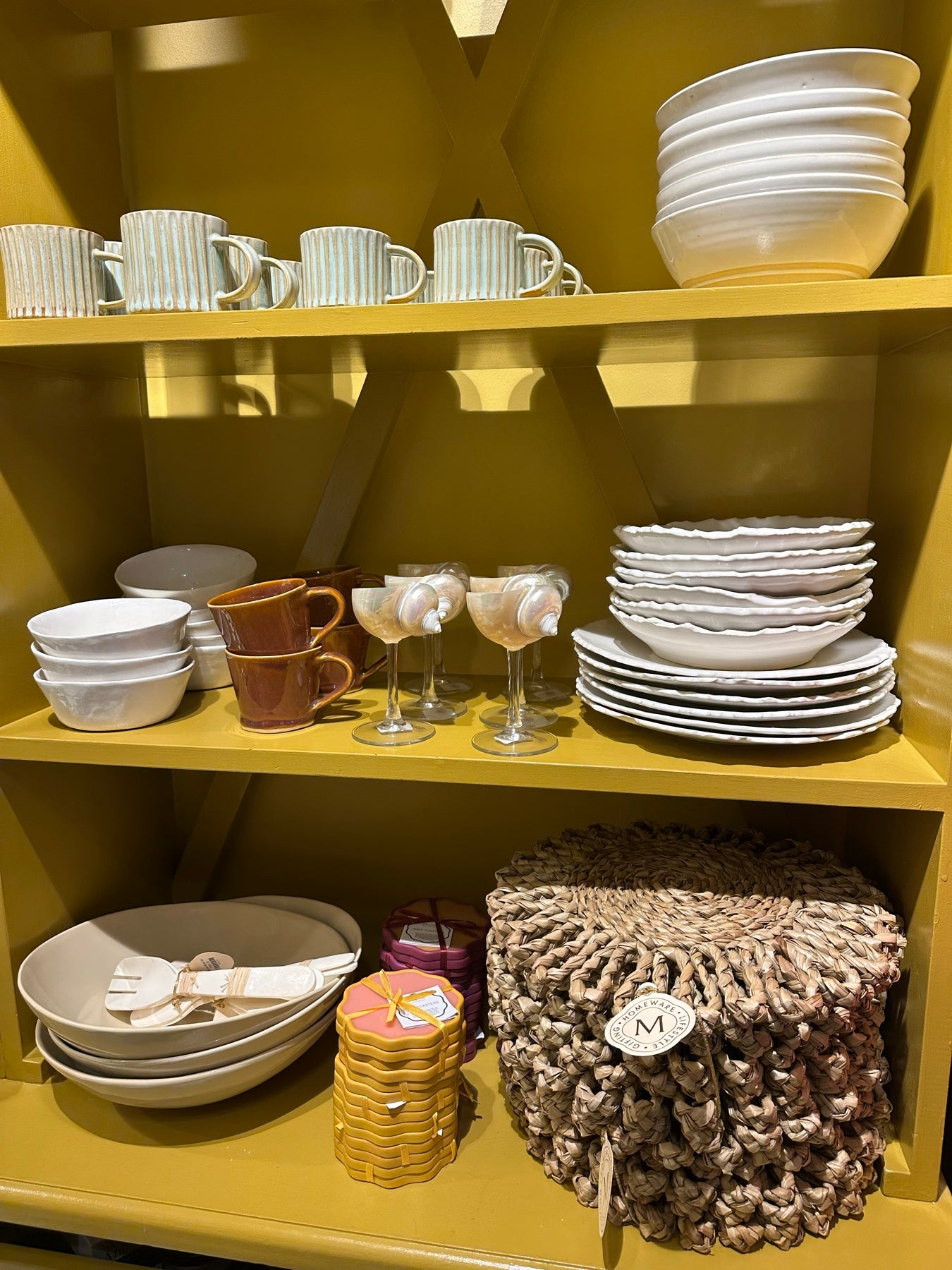 Ceramics and glassware on the yellow shelves in Camps Bay