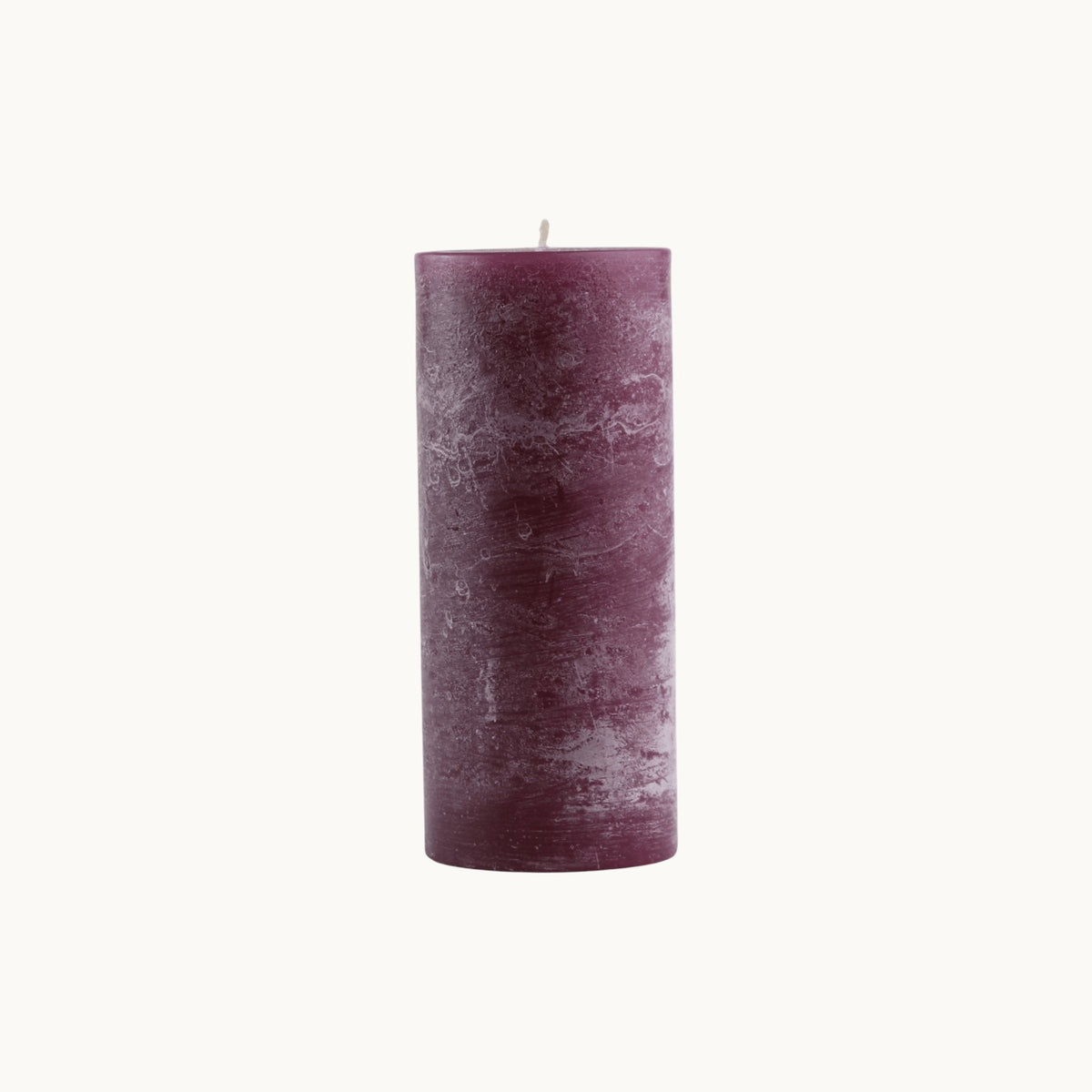 MANTRA LIVING aubergine frosted pillar candle with a textured wax finish and cotton wick. #Color_Aubergine