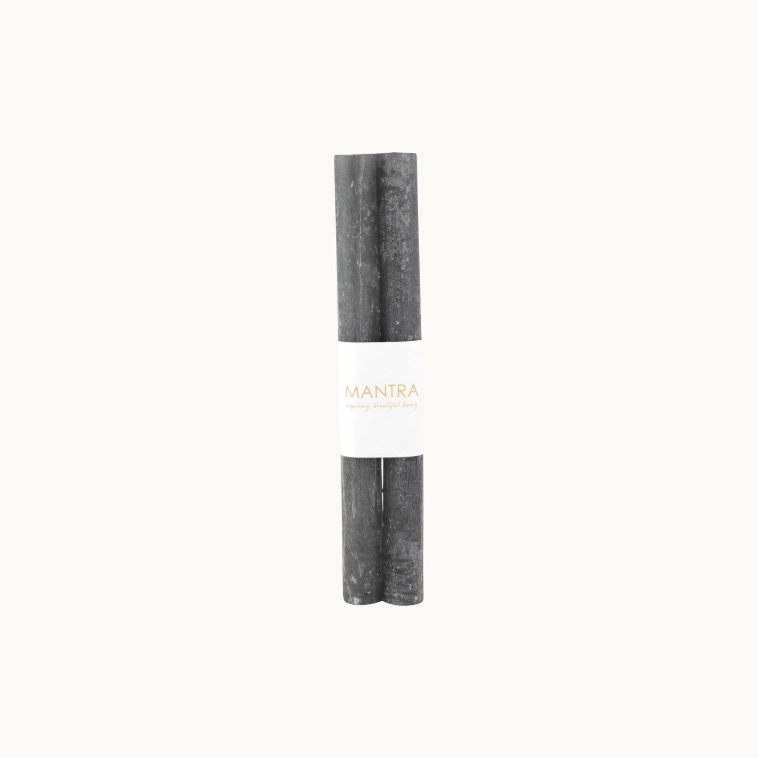 Mantra Living Frosted Dinner Candles in charcoal, a set of two dark grey tapers banded together. #Color_Charcoal