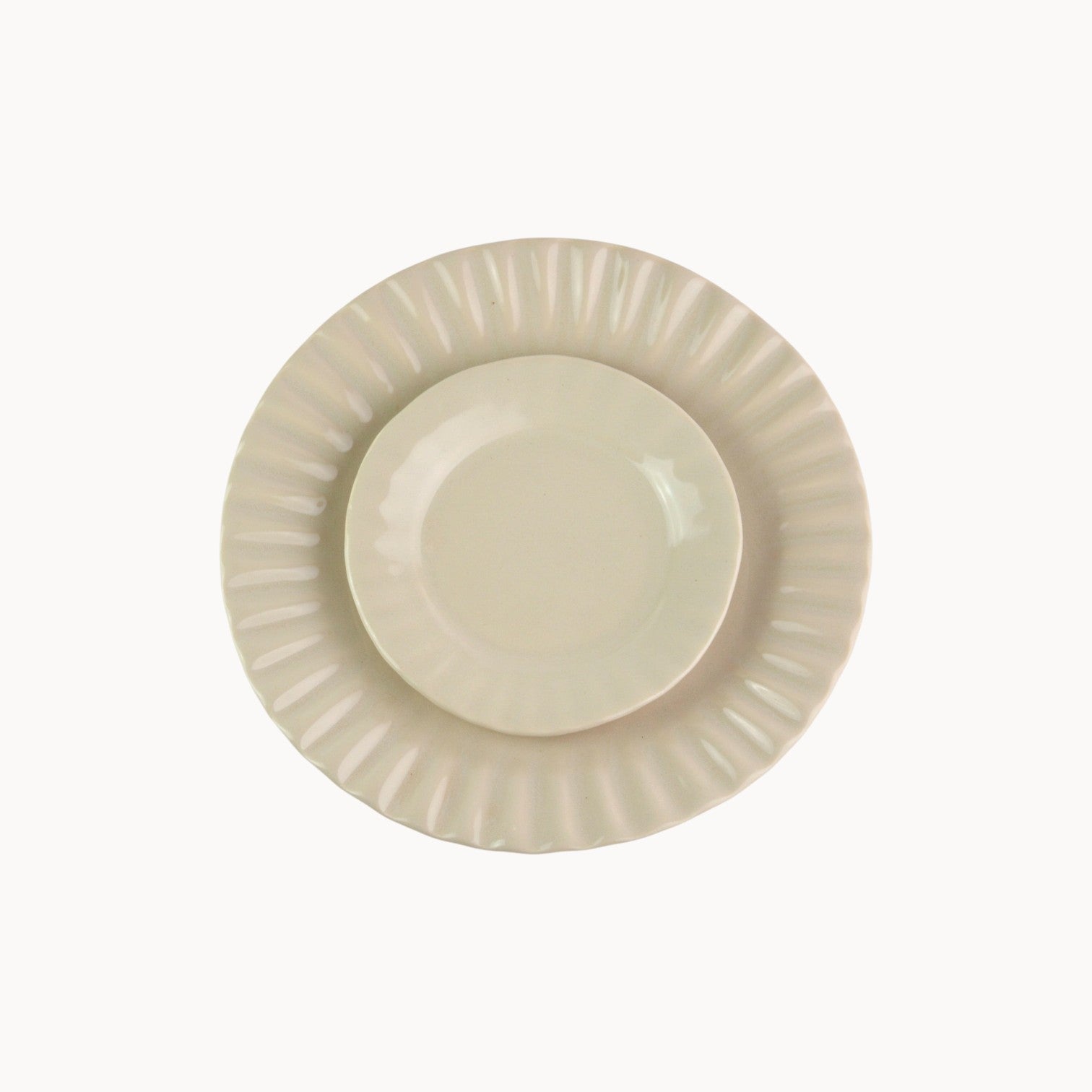 Mantra Living Daisy side plate in Almond, scalloped stoneware seen from above. #Color_Almond