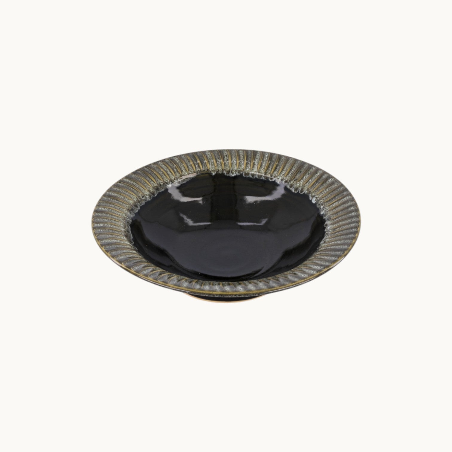 MANTRA LIVING handcrafted ceramic centerpiece bowl with a glossy black finish and textured fluted rim.