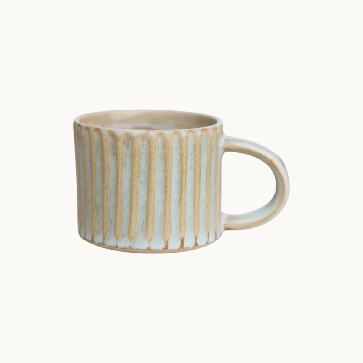 MANTRA LIVING wheel-thrown espresso mug in desert oasis glaze with a hand-fluted ridged surface. #Color_Desert Oasis