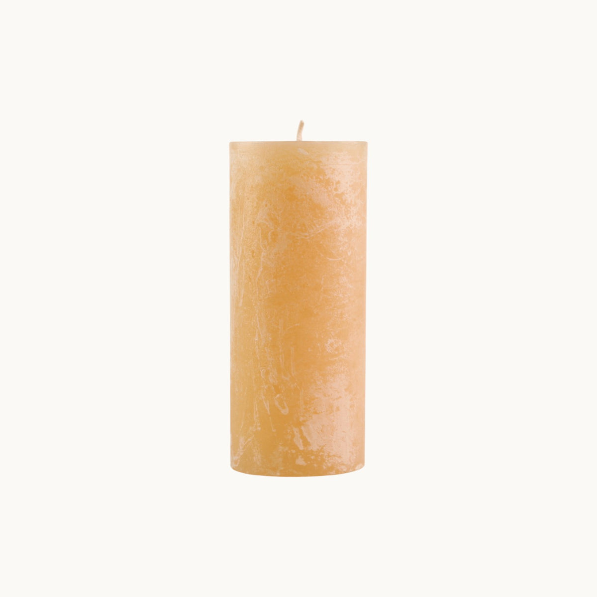 MANTRA LIVING honey yellow unscented frosted pillar candle with a textured wax finish on a white background. #Color_Honey