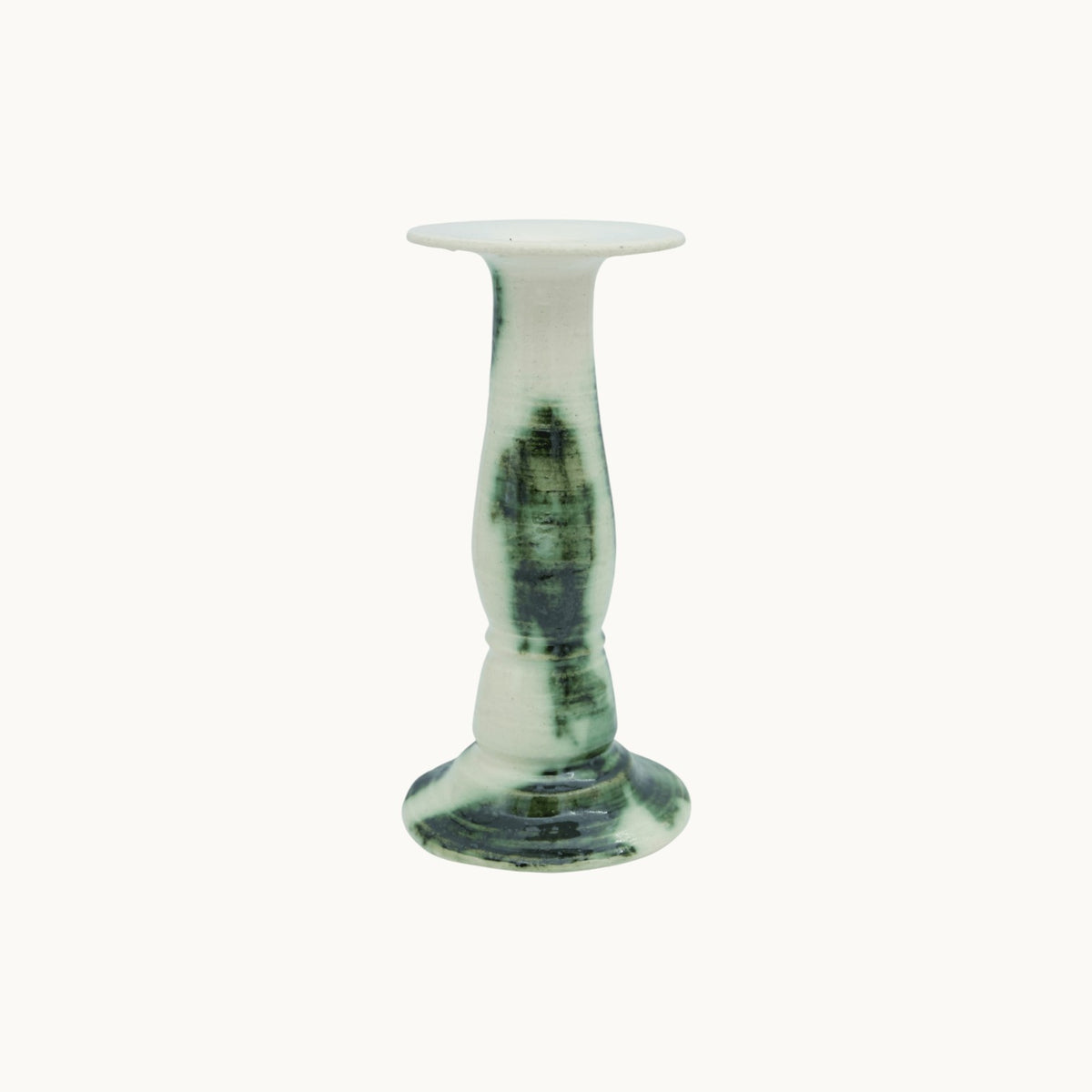 The Siena candlestick holder in Verde, cream ceramic with dark green marbled glaze, tall 23cm size on a turned pedestal stem. #Color_Verde