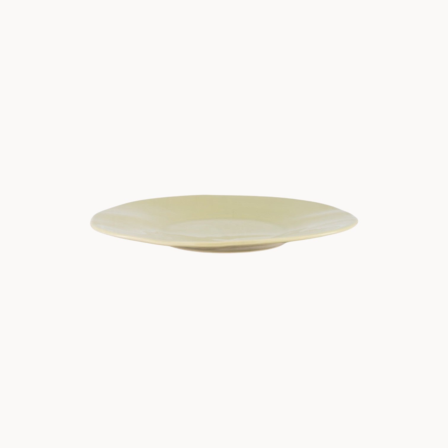 Mantra Living Classic Stoneware presentation plate in Sea Lettuce, hand-finished by Mervyn Gers, seen in profile. #Color_Sea Lettuce