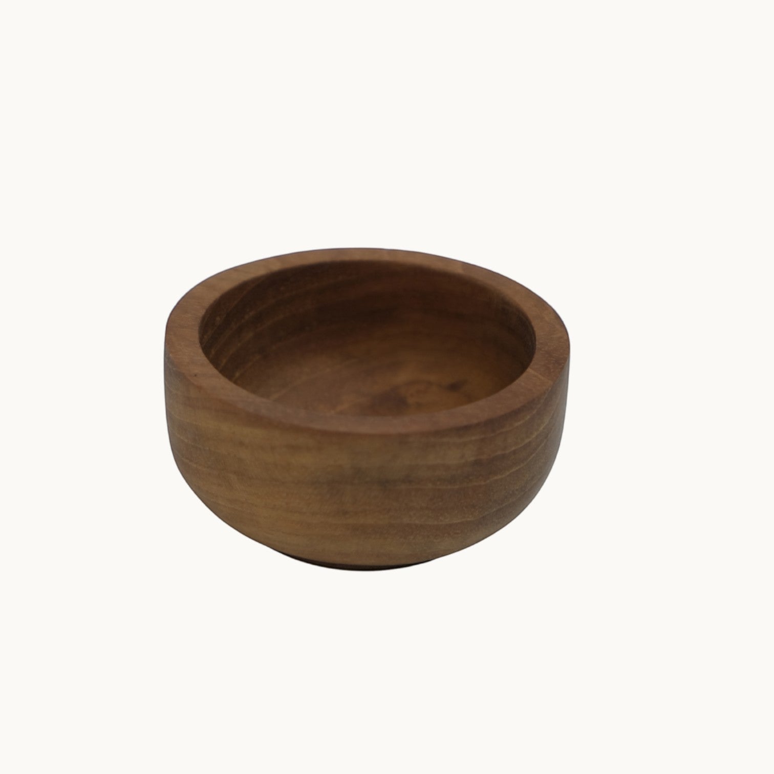 Mantra Living teak salt pinch pot in the small size, solid teak with a narrower, deeper bowl, seen from above. #Size_Small