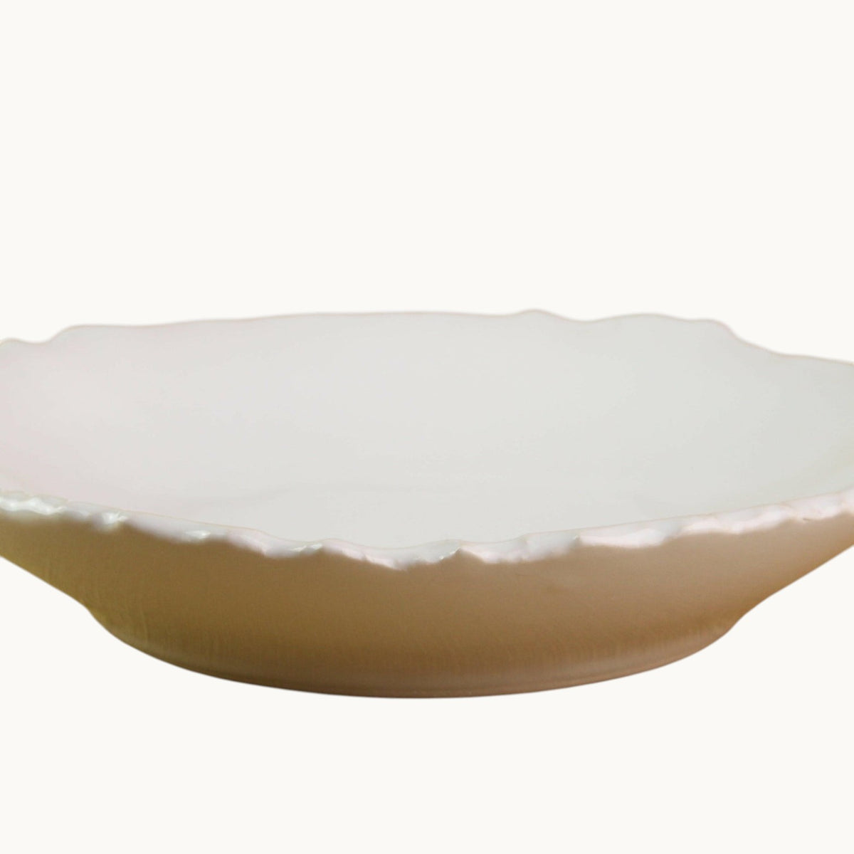 Mantra Living Raw-edged Pasta Bowl in white stoneware, seen side on to show the shallow bowl and raw rim.