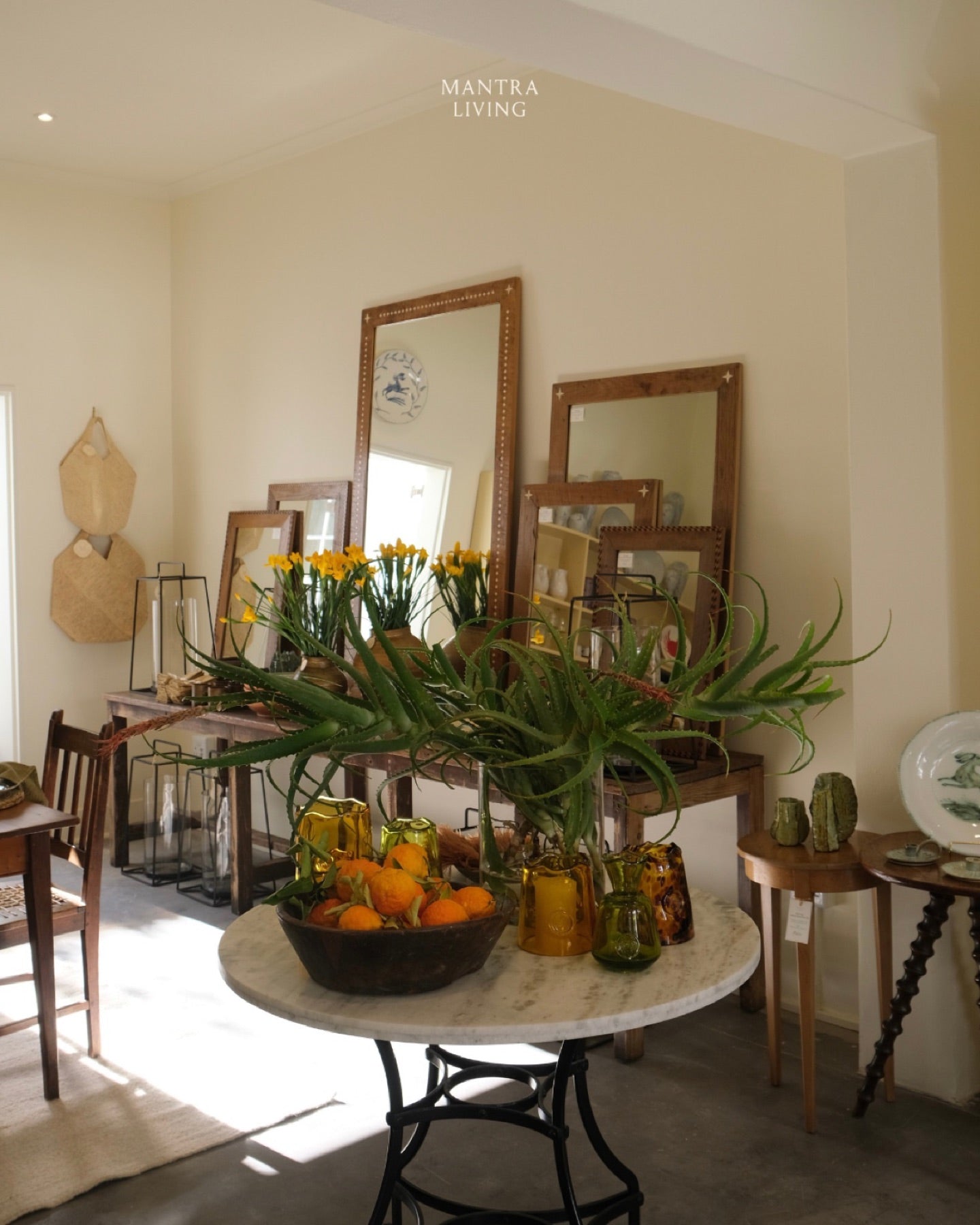 The Watson Street shop floor: mirrors brass and a table of fresh fruit