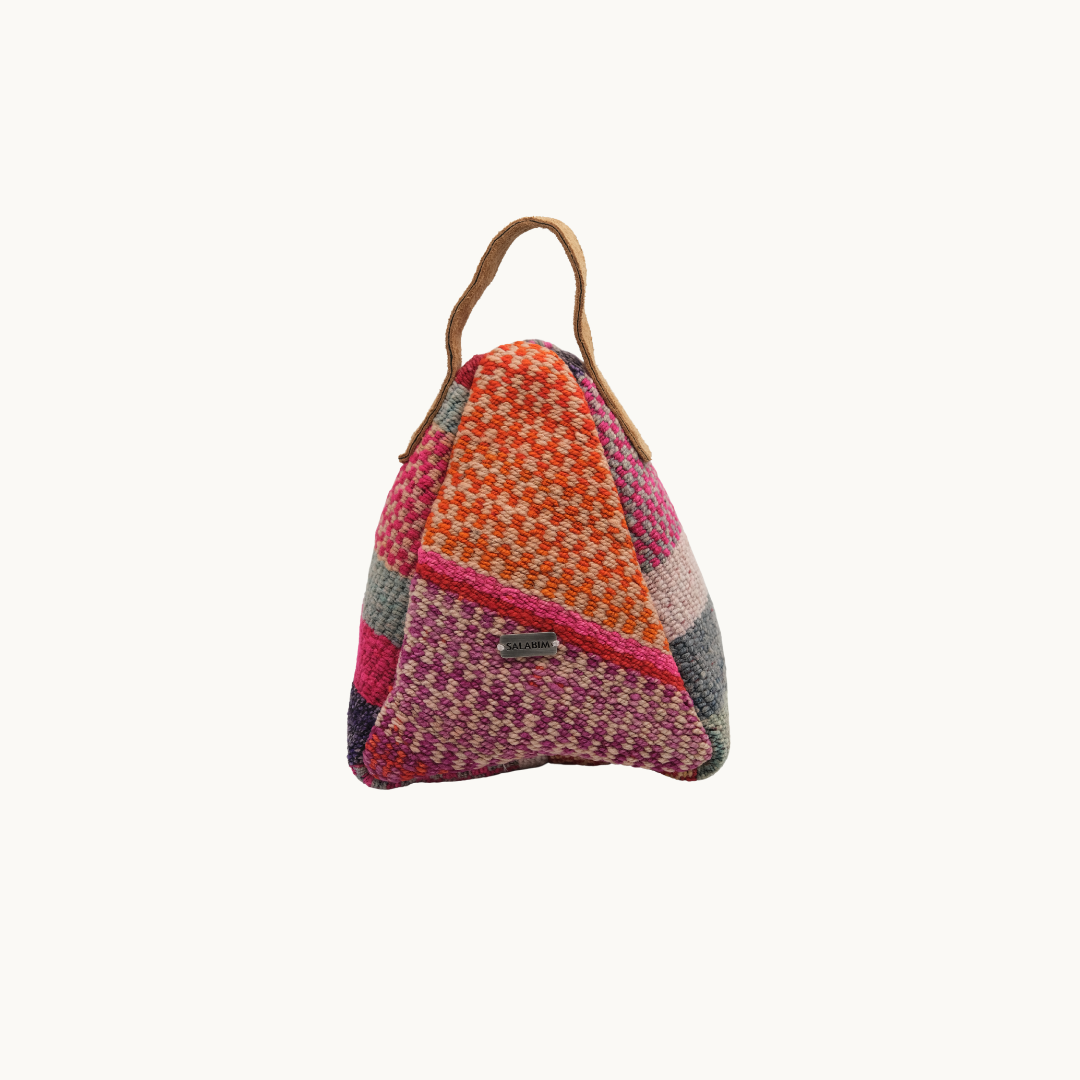 Salabim weighted door stop in ochre, magenta and grey woven patchwork with a tan leather loop, front view #color_Ochre Patchwork