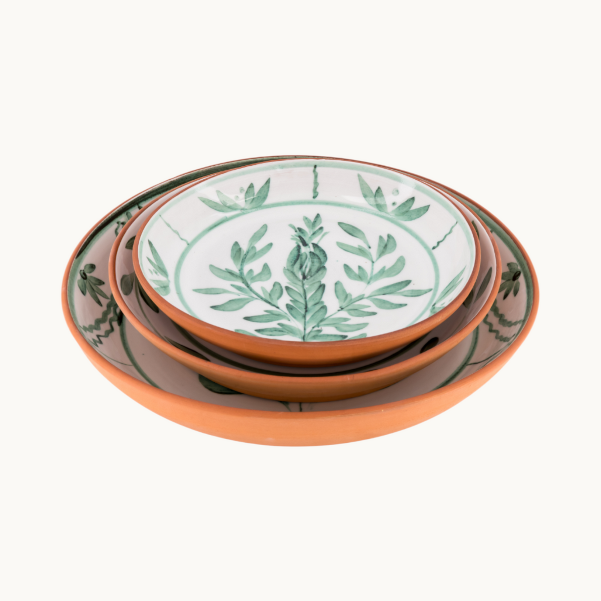 MANTRA LIVING Lebrillo platter set in terracotta with white glazed interior and hand-painted green botanical motifs.