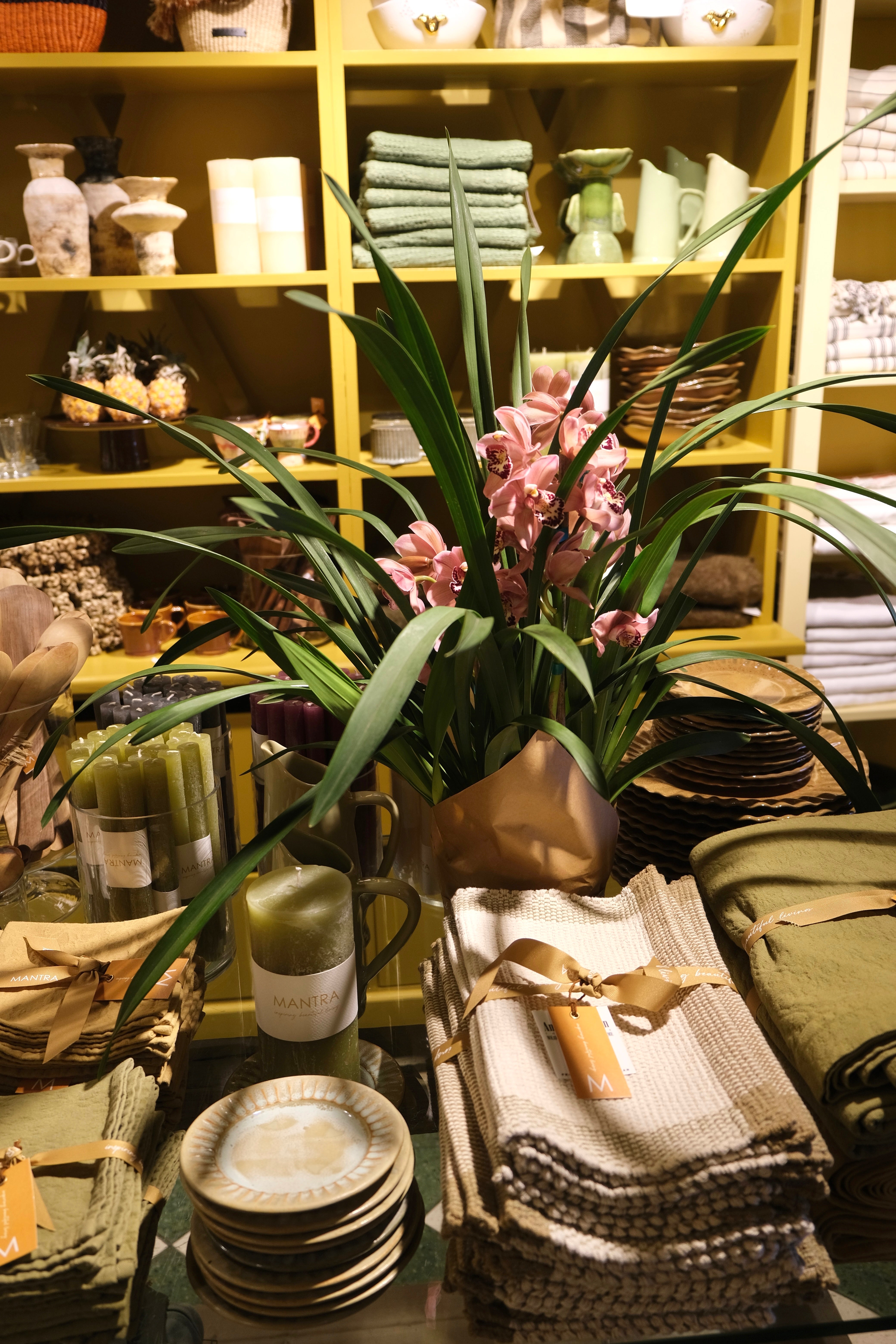 Inside the Camps Bay shop: flowers, ceramics and table linen on display