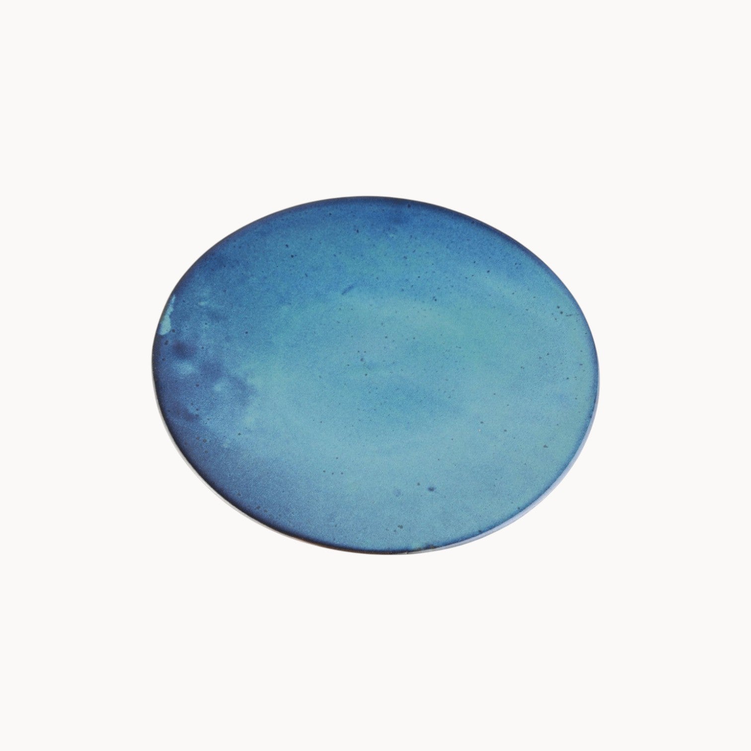 Mantra Living Classic Stoneware presentation plate in Rockpool, a deep blue reactive glaze that pools across the surface. #Color_Rockpool