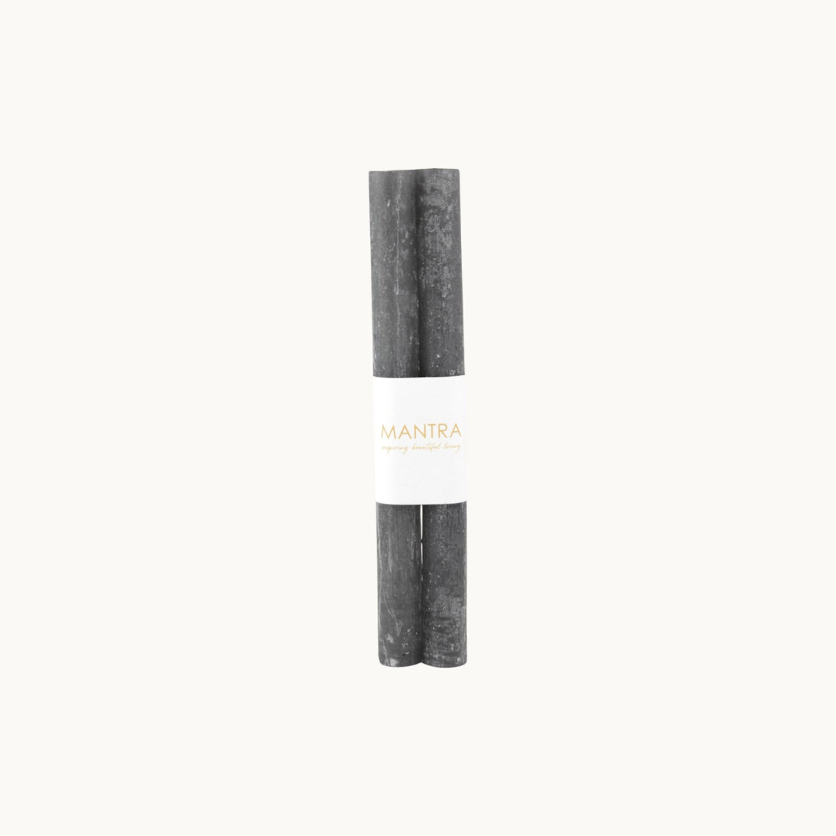 Mantra Living Frosted Dinner Candles in charcoal, a set of two dark grey tapers banded together. #Color_Charcoal