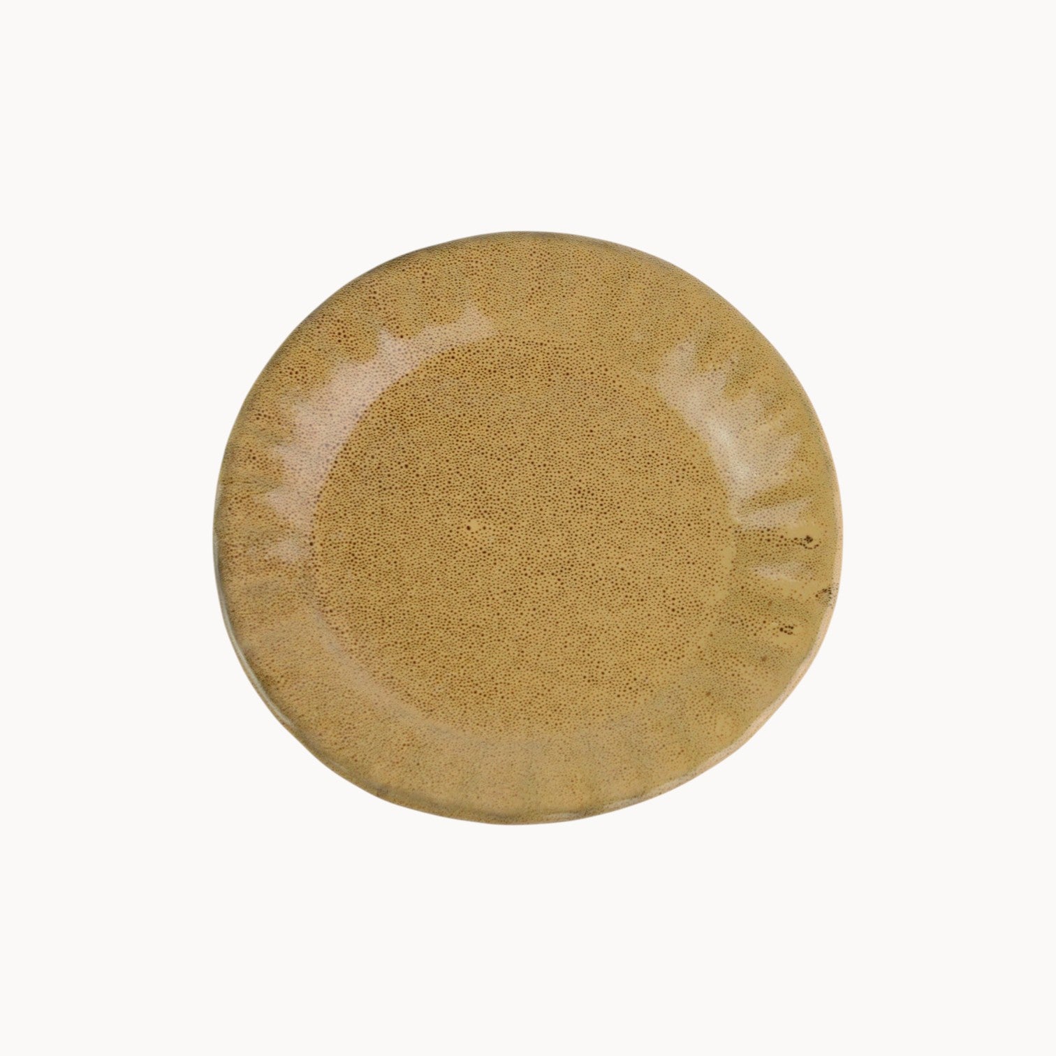 Mantra Living Daisy side plate in Kalahari, a warm tan glaze on scalloped stoneware, seen from above. #Color_Kalahari