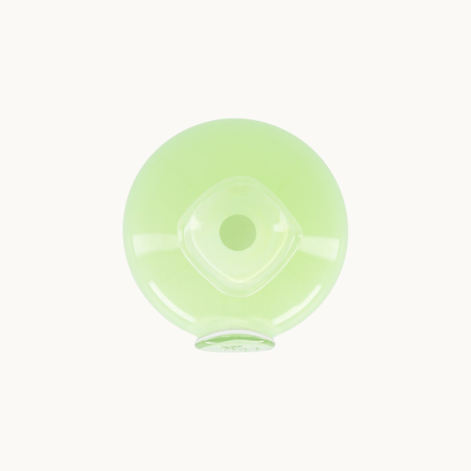Top-down view of a light green MANTRA LIVING Casa LV Emily mouth-blown glass vase with a rounded base and  #color_Matt Opal Nile Green