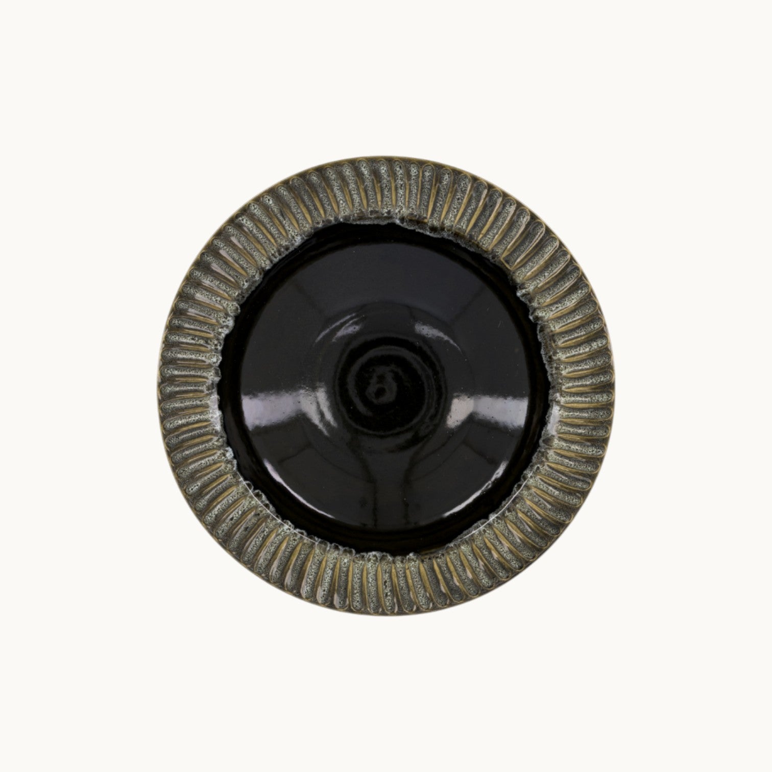 MANTRA LIVING handcrafted ceramic centerpiece bowl with a glossy black interior and textured fluted rim