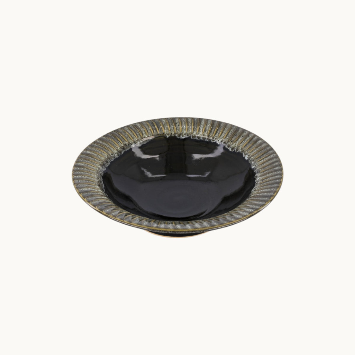 MANTRA LIVING handcrafted ceramic centerpiece bowl with a glossy black finish and textured fluted rim.