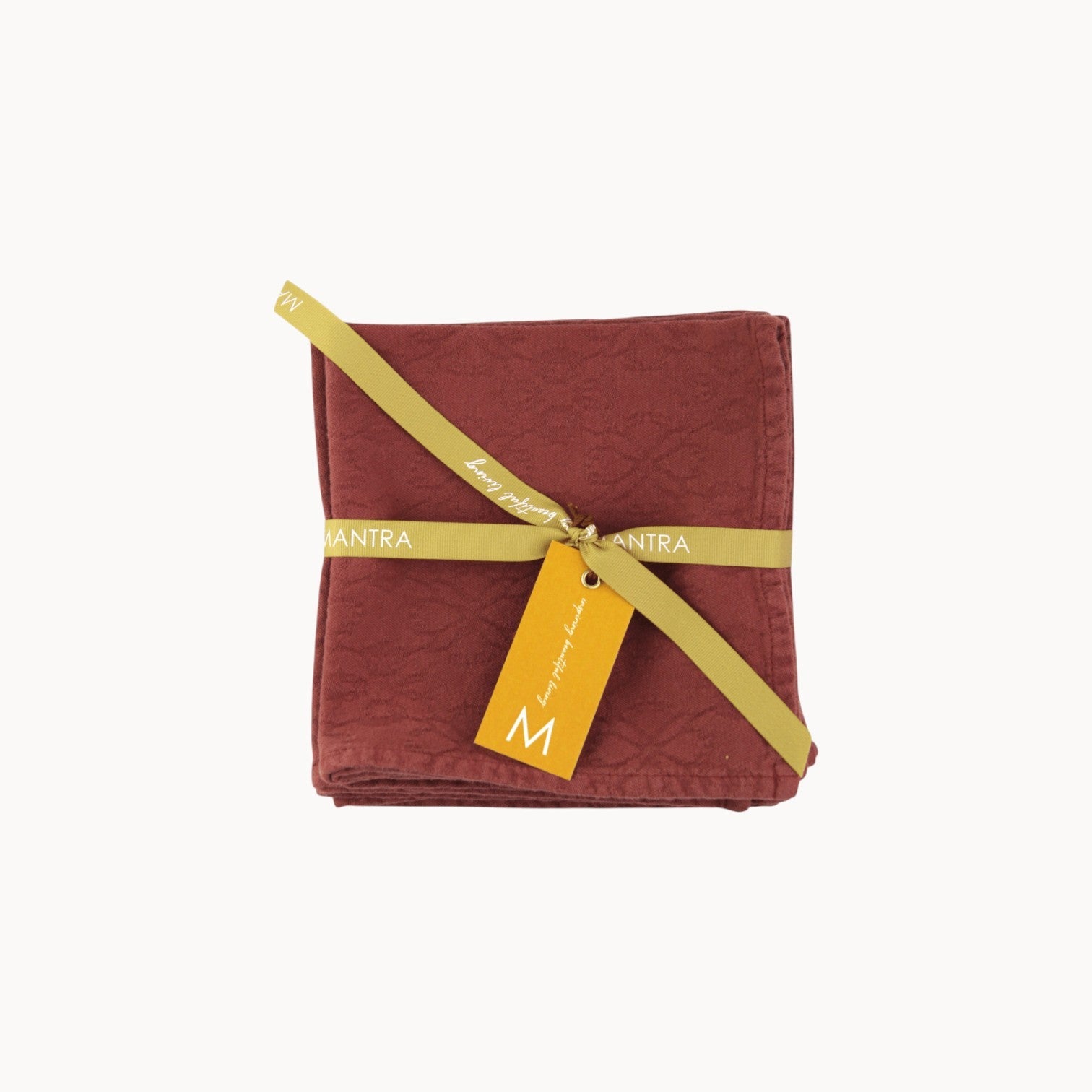 Mantra Living Hibiscus cotton napkins in maple red, jacquard-woven set of four tied with a branded ribbon and tag. #Color_Maple