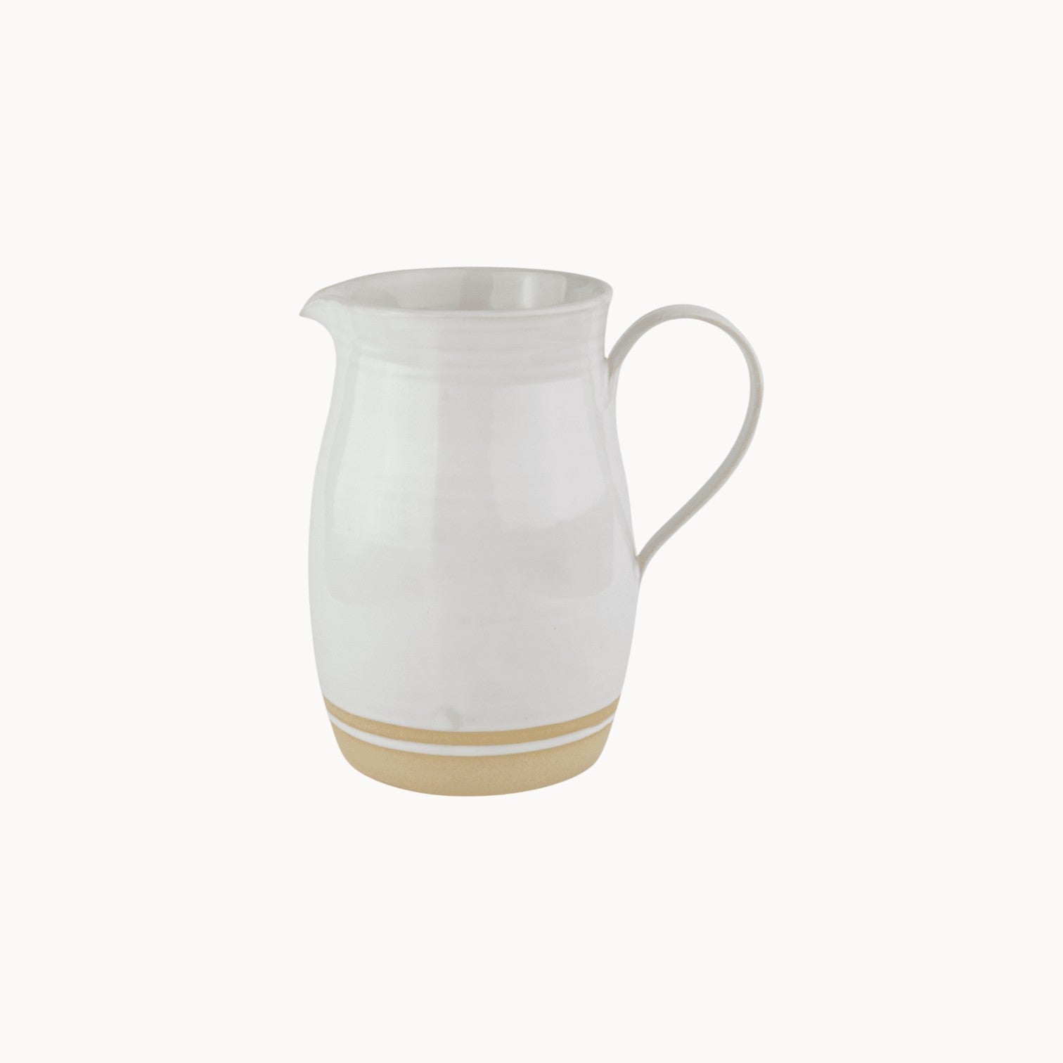Mantra Living Milkstone Jug in the small size, handmade ceramic pitcher with a soft milky glaze and a raw unglazed base. #Size_Small