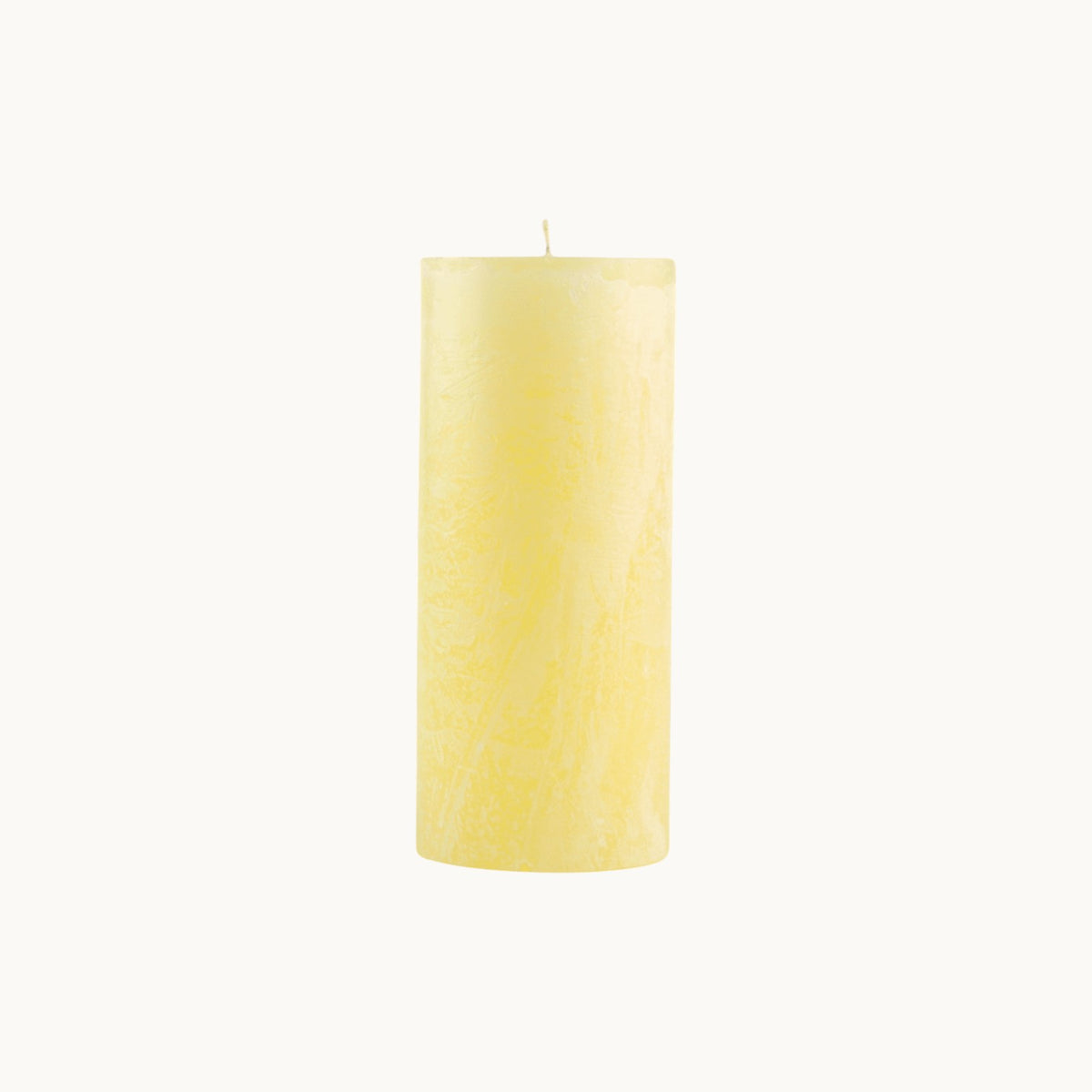 MANTRA LIVING unscented pastel yellow frosted pillar candle with a textured wax finish and cotton wick. #Color_Pastel Yellow