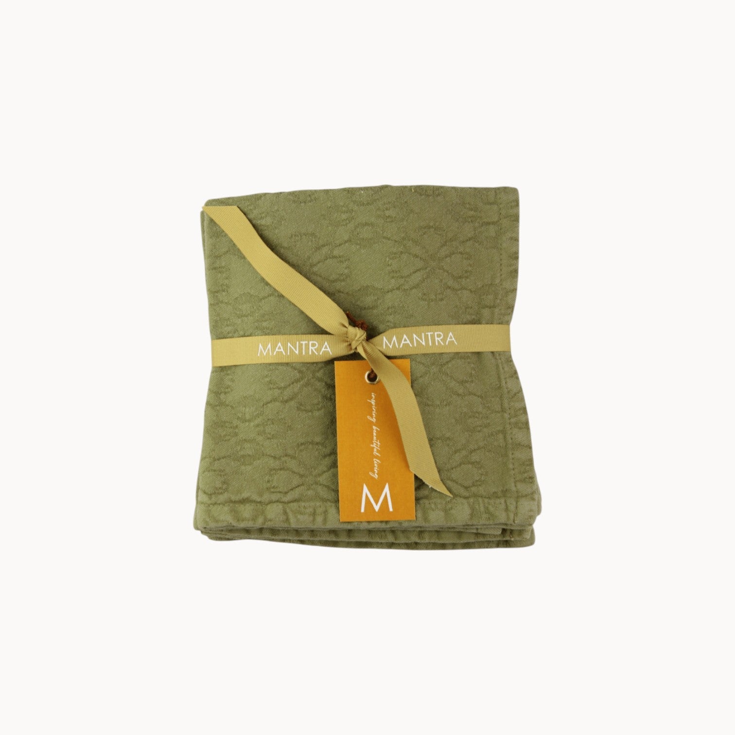 Mantra Living Hibiscus cotton napkin in pistachio green, jacquard-woven with a hibiscus pattern and branded ribbon tie. #Color_Pistachio