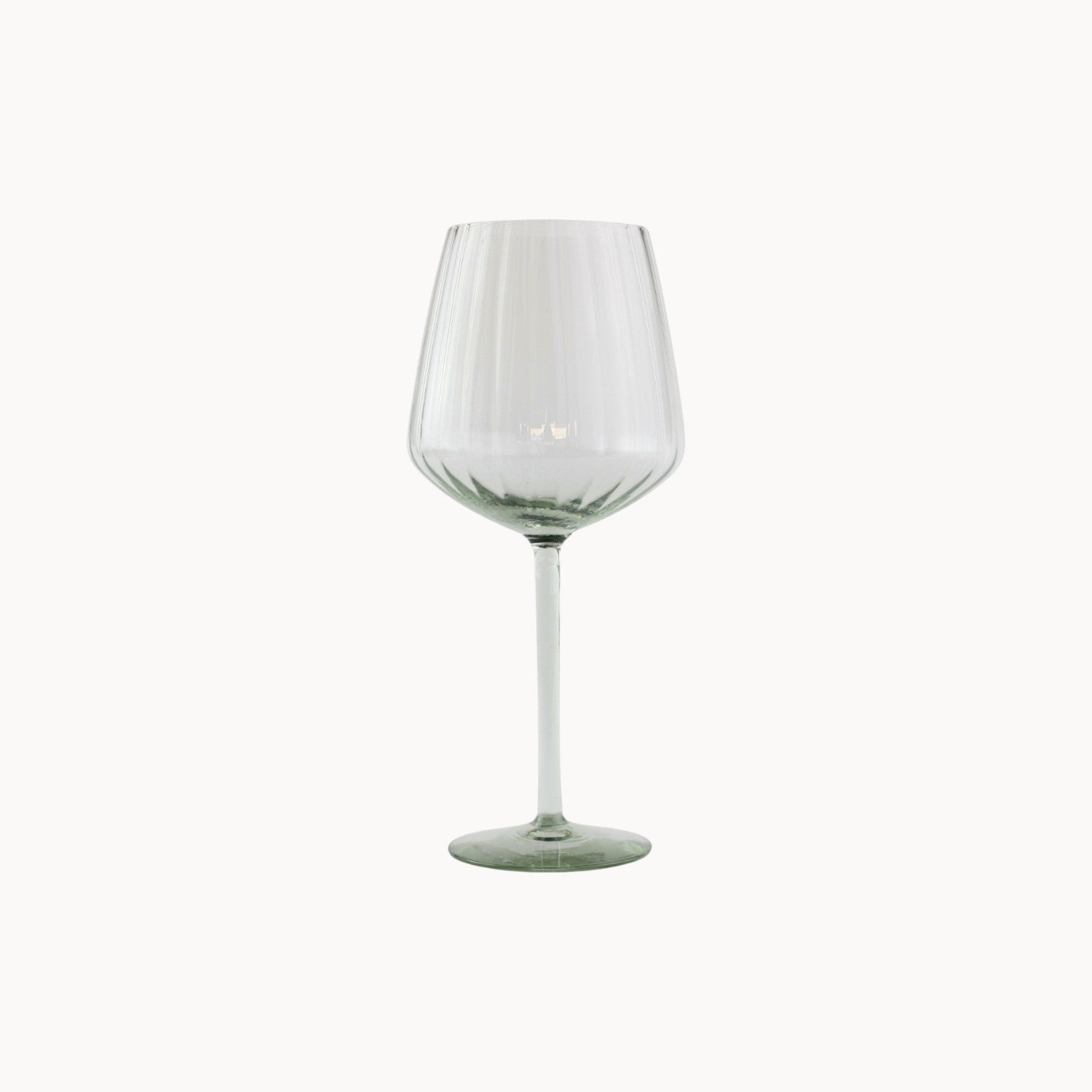 Mantra Living ribbed red wine glass, hand-blown from recycled glass with vertical ribbing, a generous bowl and a slim stem.