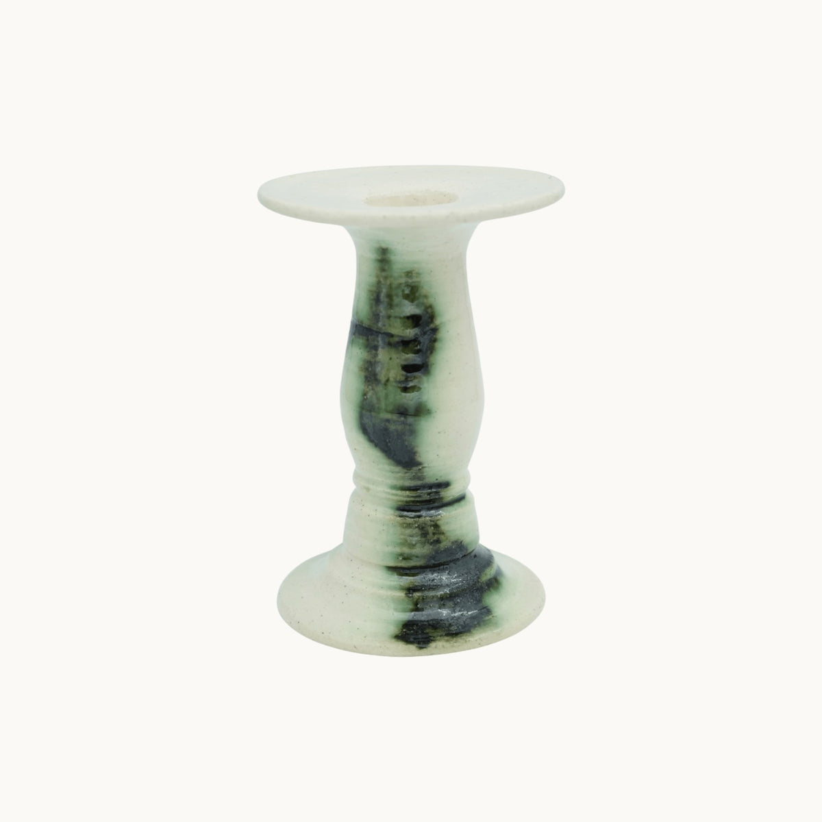 The Siena candlestick holder in Verde, cream ceramic with dark green marbled glaze, short 14.5cm size on a turned pedestal stem. #Color_Verde