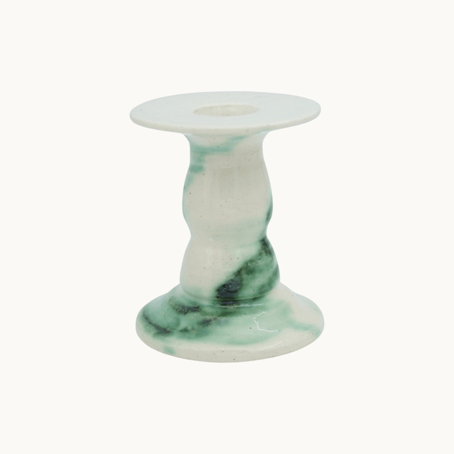 The Siena candlestick holder in Verde, cream ceramic with dark green marbled glaze, extra short 10cm size with a squat base. #Color_Verde