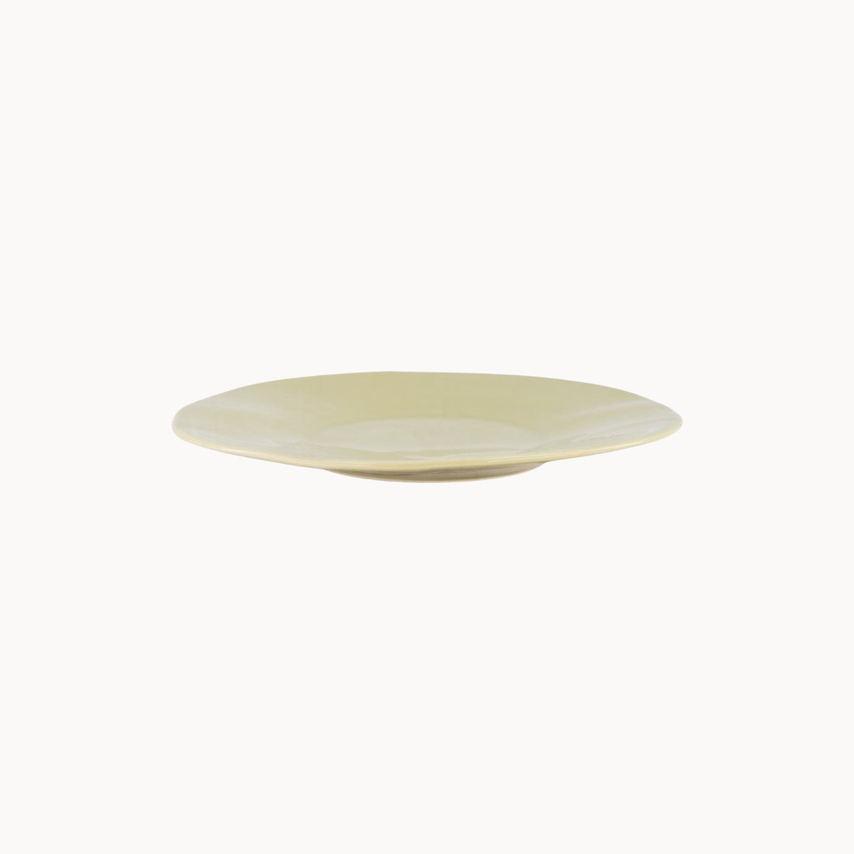 Mantra Living Classic Stoneware presentation plate in Sea Lettuce, hand-finished by Mervyn Gers, seen in profile. #Color_Sea Lettuce