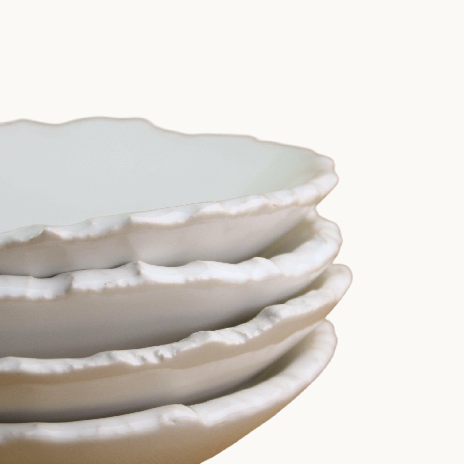 Mantra Living Raw-edged Pasta Bowls stacked, showing the torn, uneven glaze edge on each rim.