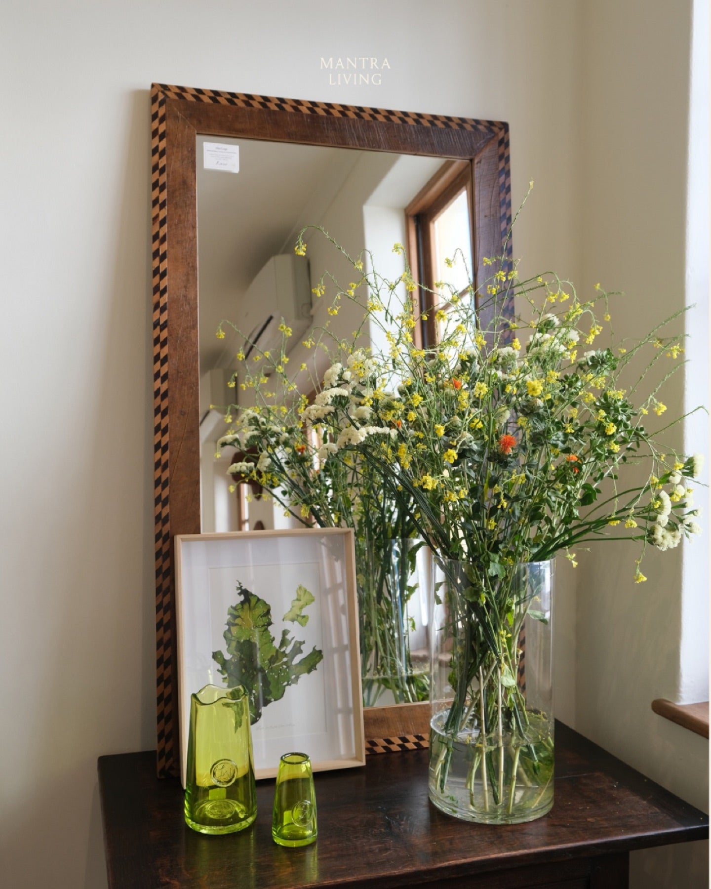 Wildflowers in front of the brass mirror at Watson Street