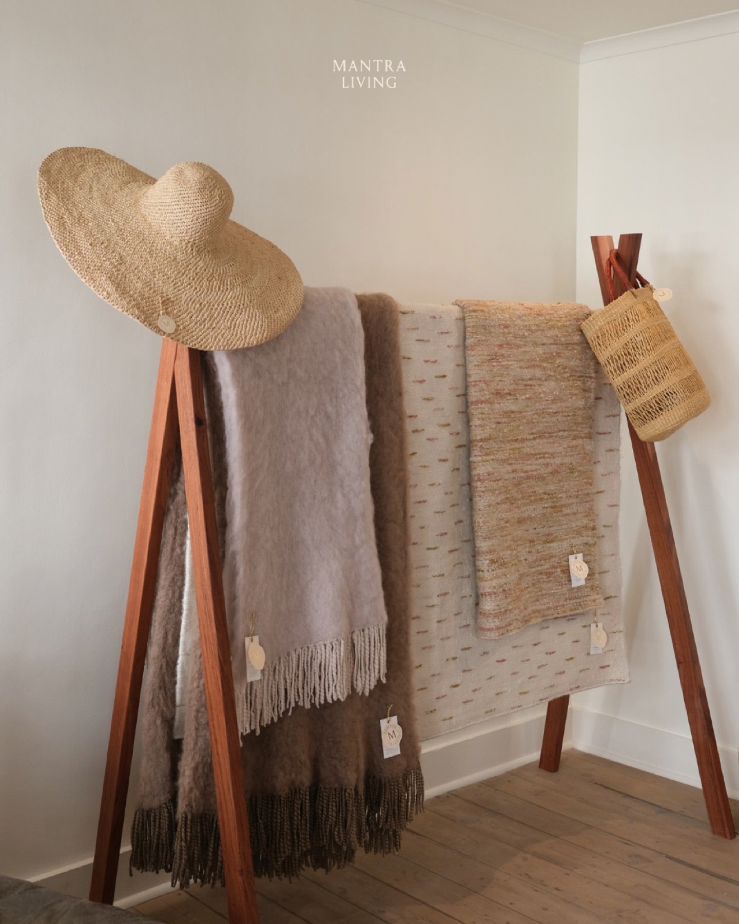 Throws and a raffia hat on the ladder at Watson Street